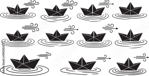Black paper boats on water with wind and ripples