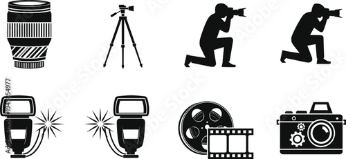 Male photographer silhouette crouching with camera and flash taking photo of young female model standing in studio isolated on white.