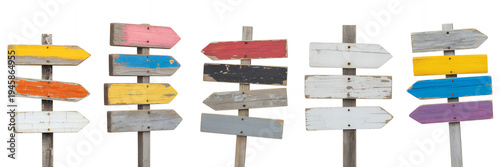 Wooden directional signs on poles with multiple arrows