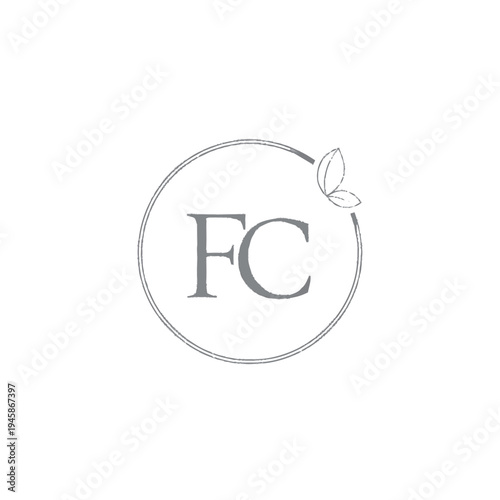 Monogram Logo with Circle and Leaves.