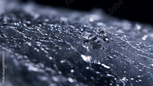 Extreme close up macro footage of ice crystals forming and glistening with light motion
