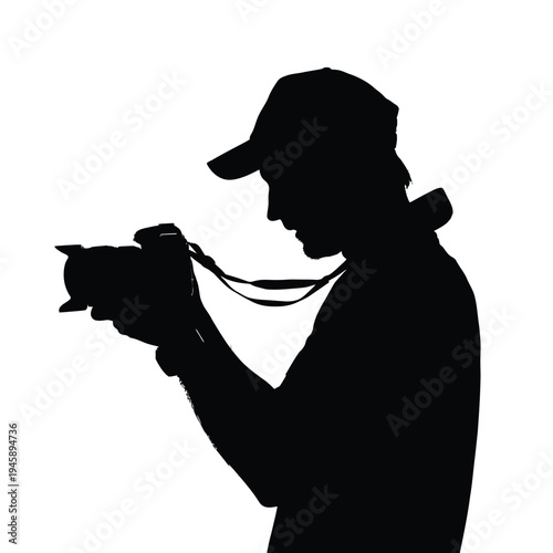 Silhouette of a photographer with a camera and cap in profile