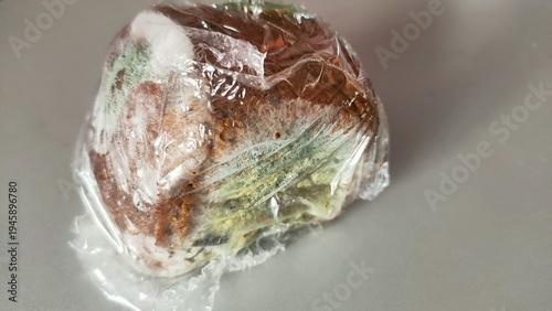 Konstfotografi green moldy bread in a film package