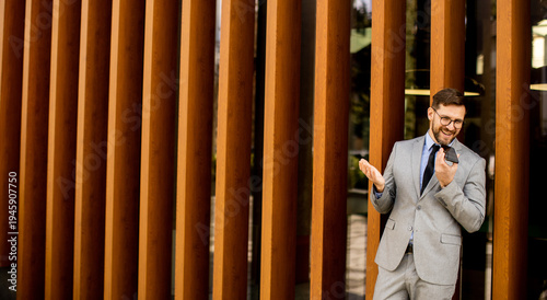 Man in a suit talks on the ...