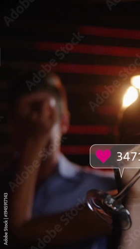 Vertical video: Hand holding flute raising in bar, group toasting causing social updates near glass