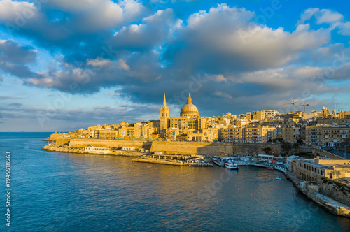 Drone view of Valletta city - capital of Malta. Sunset, church. Mediterranean sea
