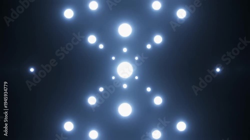 Bright glowing abstract lights arranged in dynamic pattern on dark background motion graphic