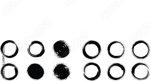 A collection of 12 black ink brush strokes forming oval shapes on a white background