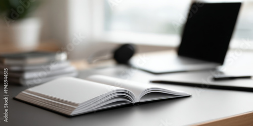 Open notebook on modern workspace desk