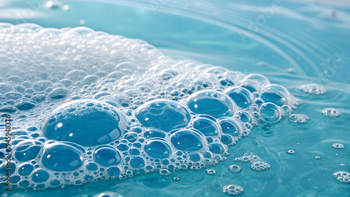 Underwater close up view featuring clear blue water with many transparent oxygen bubbles rising towards surface with bright backlighting creating refreshing aquatic background texture