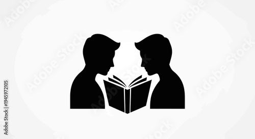 Two people reading a book together.
