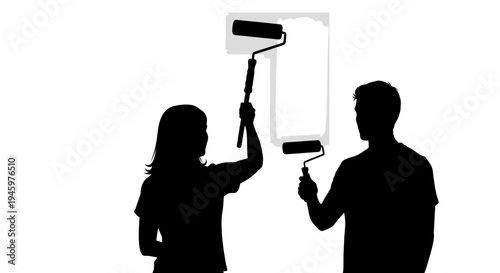 Silhouette of people holding paint rollers.