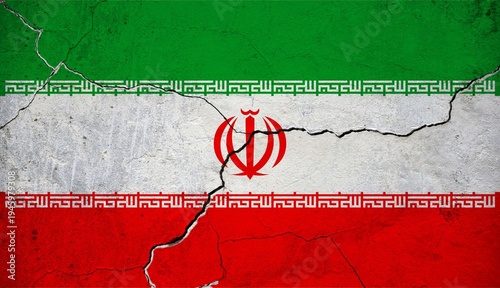 An image of the Iran flag on a wall with a crack.