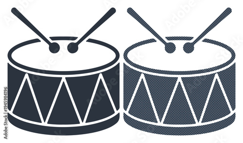 Two drums with sticks, ready for a rhythmic beat.