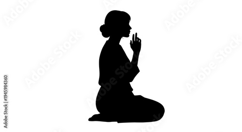 Silhouette of a woman meditating peacefully.