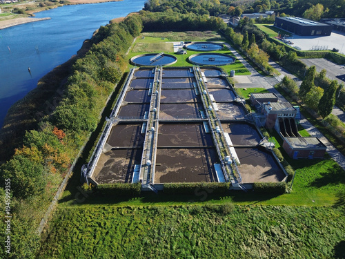 Obraz na płótnie Danish wastewater treatment plant located beside the water, offering a clear view of the surrounding fjord and natural landscape