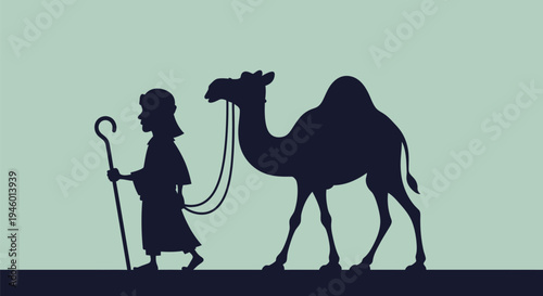 Man walking with a camel.