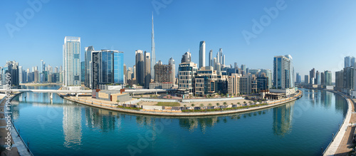 Panoramic skyline of Dubai with modern skyscrapers and futuristic architecture at sunset. Iconic cityscape of the largest city in the United Arab Emirates, famous for luxury tourism, business district