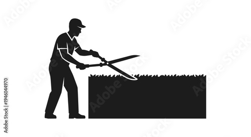 Man cutting grass with hedge shears.