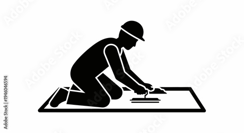 Man working on a large sheet.