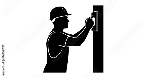 Man wearing hard hat installing switch.