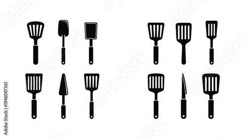 A collection of black kitchen spatulas in a minimalist silhouette