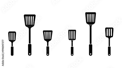 Collection of black spatulas in various sizes a minimalist silhouette