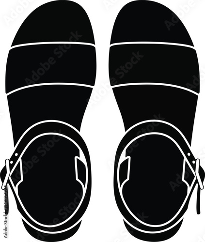 Top down view of a pair of black stylish sandals for women with ankle straps and buckles