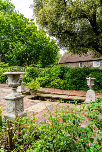 Fotografie Fishpond in the flower garden of Monk's House, former home of writer Virginia Woolf, historic literary landmark surrounded by nature in East Sussex, United Kingdom
