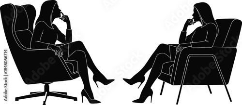 Silhouette of two professional women sitting in modern armchairs facing each other in a therapy session, counseling, or business interview.