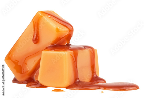 Sweet caramel candies with caramel sauce isolated on a white background. Delicious candies with caramel topping.