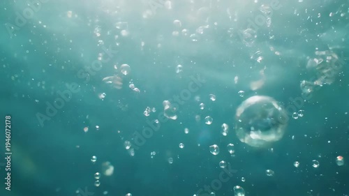 Underwater Bubbles Rising to Surface in Clear Blue Water.