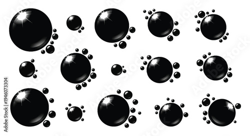 Glossy black spheres of varying sizes arranged on a clean white background