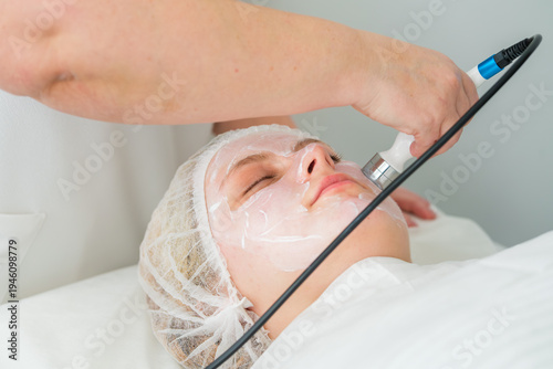 Client enjoys a non-invasive RF lifting procedure at a professional beauty clinic, enhancing skin texture and promoting collagen production.