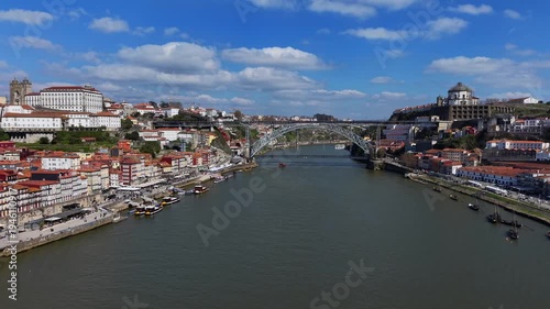 Porto, Portugal. Aerial view of bridge Ponte Luís I and famous historical district Ribeira. 4K video.