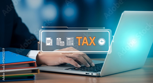 Taxation concept with icons and a person working on a laptop at a desk with files