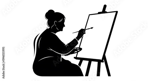 Silhouette A silhouette of a woman painting on an easel with a brush in her hand.