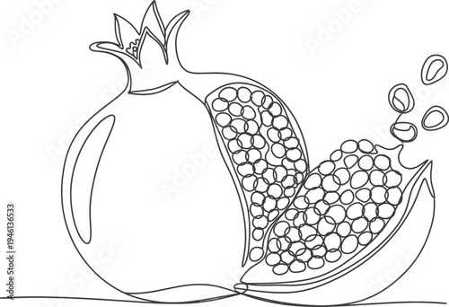 A pomegranate cut in half with seeds spilling out