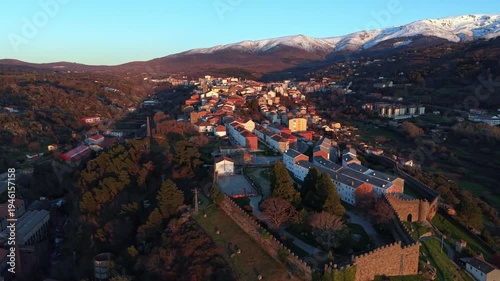 Aerial images of Bejar in the province of Salamanca with the Sierra Nevada mountains in the background during sunset, 4k 30fps 1 inch sensor DJI, drone image