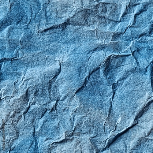 Seamless pattern of rich ultramarine blue crinkled paper with tactile wrinkle detail for professional print and digital templates