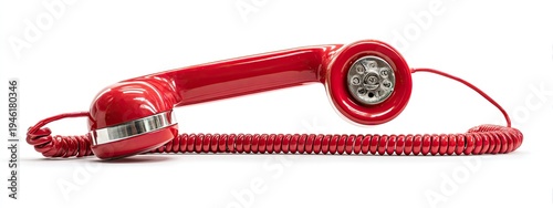 A red vintage telephone handset with a coiled cord lays on a white background