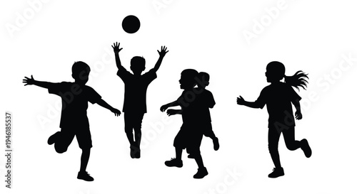 Silhouettes of energetic children playing outdoors together with a large round ball