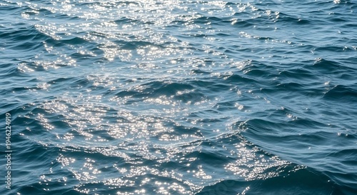 Sparkling Ocean Water Surface with Sunlight Reflections.