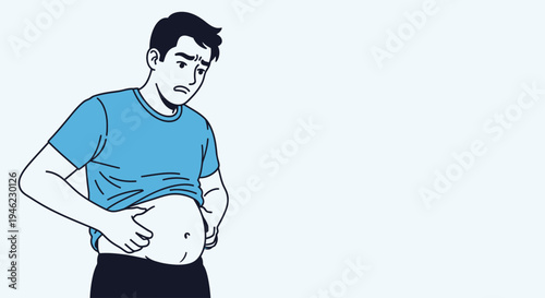 Man pinches belly fat in closeup with copy space, highlighting weight gain, body image concern, fitness motivation at home