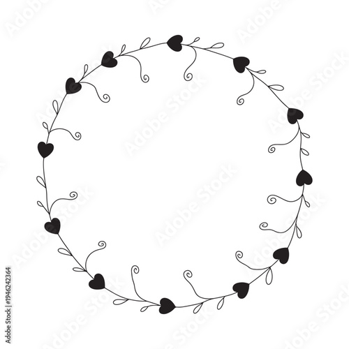 A delicate circular wreath composed of black hearts and swirling vine elements