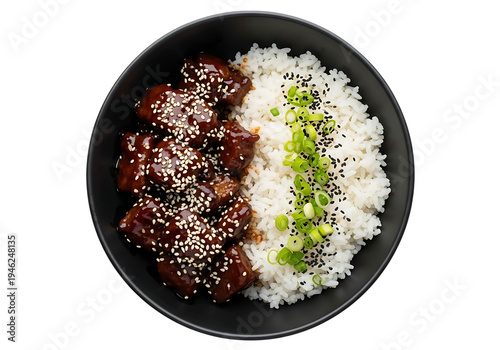 Top view of savory teriyaki chicken with sesame seeds, white rice, and green onions in a black bowl.