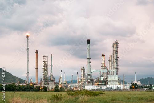 Oil refinery plant. Processing crude oil into essential petroleum products i.e. gasoline, diesel. Industrial landscape represents petrochemical manufacturing, energy production and petroleum industry.