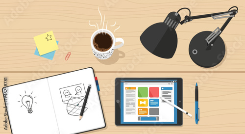 Creative workspace with tablet and notebook for design ideas.