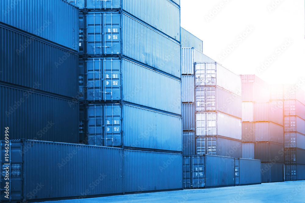 Fototapeta premium Row of Stacked Shipping Cargo Containers. Container Yard. Logistics Transportation Industry. Cargo Container ships, Global Business Shipping Import-Export. Warehouse Port. Logistics Transport.