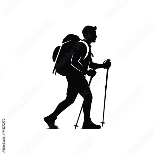 Silhouette of a hiker with backpack and trekking poles